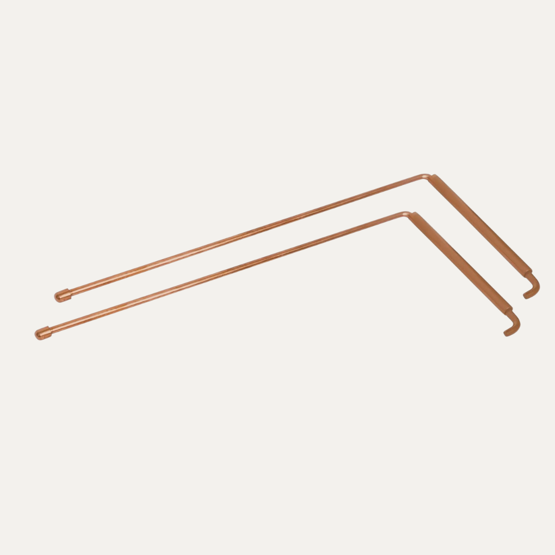 Angled copper L-rods shown together on a light neutral background