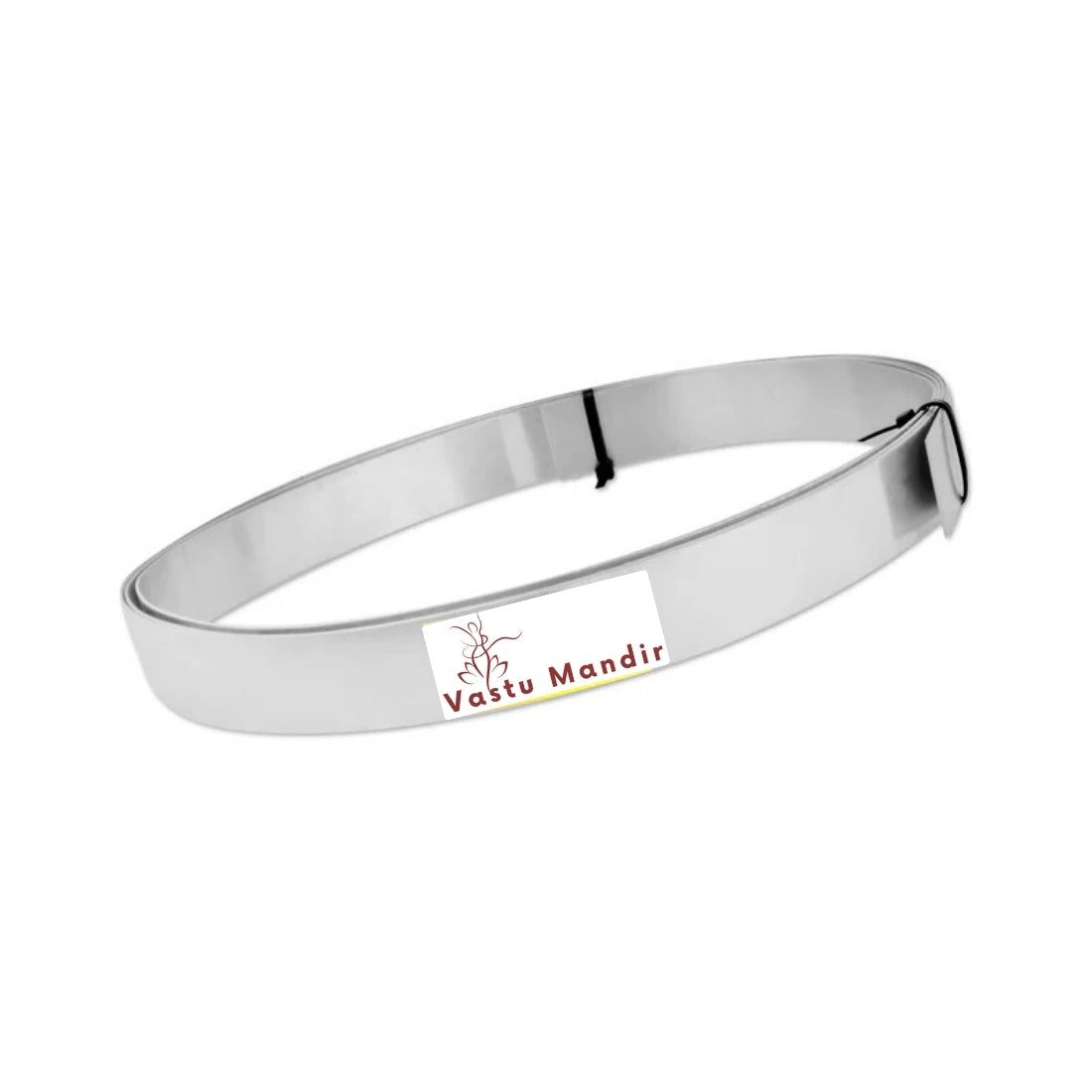Stainless steel Vastu strip formed into a shallow oval coil on a white background