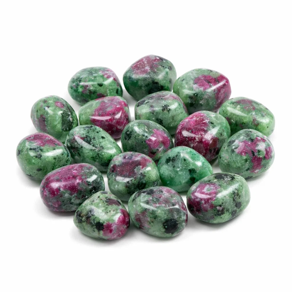 Ruby zoisite tumbled stones showing its form against a plain white background