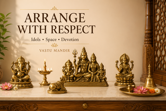 Multiple brass God idols arranged respectfully in a clean Vastu home mandir with Ganesha, Shiva, diya, bell, flowers, and sacred tray.