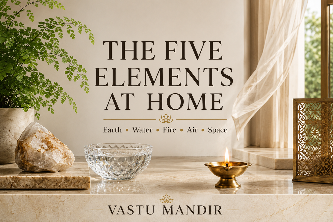 Five Vastu elements represented in a modern home with raw stone, crystal bowl, diya, plant leaves, and open space on a luxury marble surface.