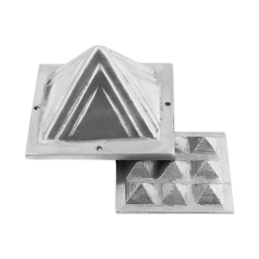 Two-layer lead Vastu pyramid shown with the upper and lower sections offset on a white background