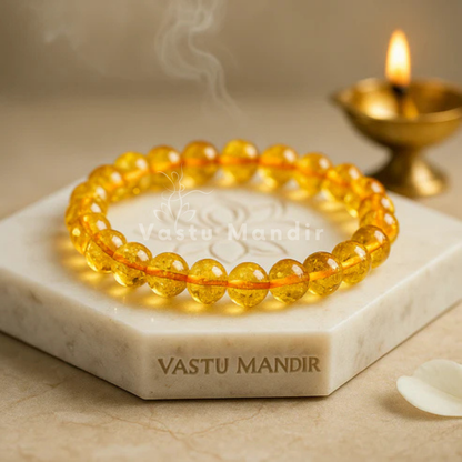 Hydro citrine crystal bracelet shown with a hand in a lifestyle photograph
