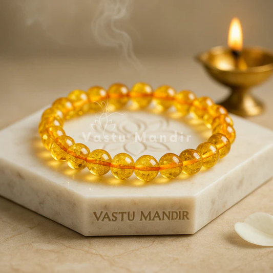 Hydro citrine crystal bracelet shown with a hand in a lifestyle photograph