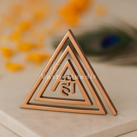 Copper Hii Vastu triangle helix standing on stone with marigold petals