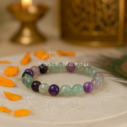 Natural fluorite crystal bracelet shown in a second hand-held product view