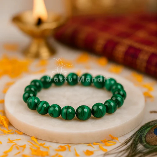 Natural green jade crystal bracelet shown with a hand in a lifestyle photograph