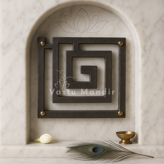 Iron Plain Vastu helix in a square spiral form mounted in a softly lit arched wall niche