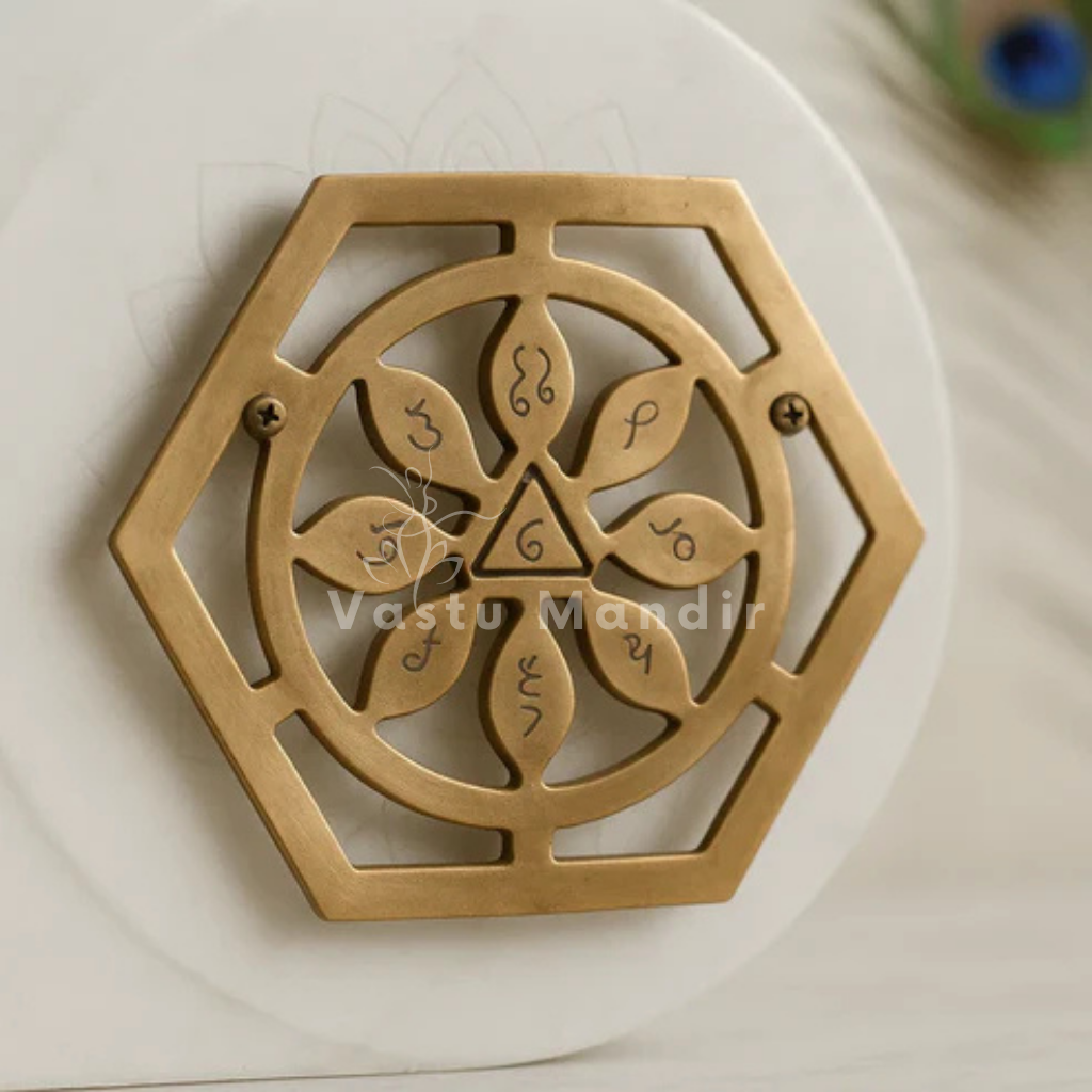 Copper bhoum yantra arranged in a styled spiritual setting