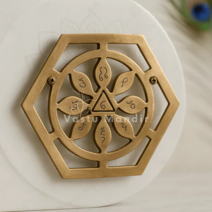 Copper bhoum yantra arranged in a styled spiritual setting