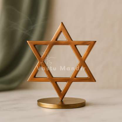 Copper star helix displayed upright on a round brass stand
