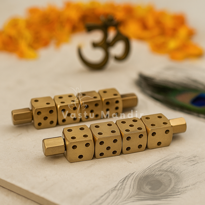 Pair of brass Ramal Pass rods displayed with Om symbol and peacock feather