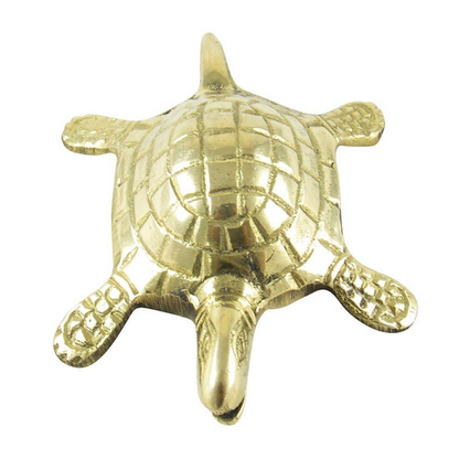 Brass tortoise idol with yantra grid top view isolated on white background