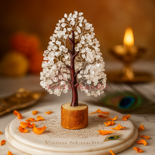 Clear quartz crystal tree displayed in a dark, softly lit spiritual setting