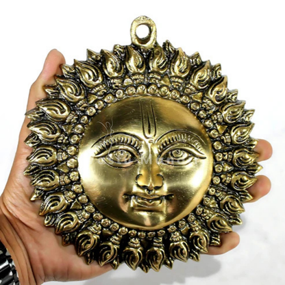 Brass surya (sun) ji wall hanging idol Vastu remedy shown in a close styled product view