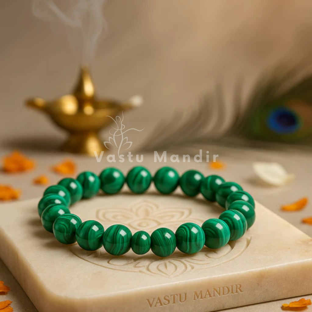 Natural malachite crystal bracelet shown in a second hand-held product view