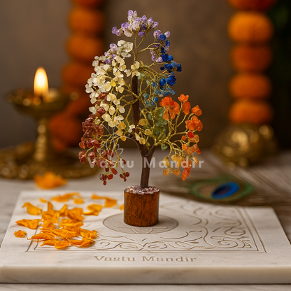 7 chakra crystal tree arranged in a warm low-light product setting