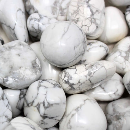 Natural howlite tumbled stones arranged in a styled spiritual setting