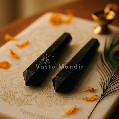 Larvokite Vastu pencil displayed in a dark, softly lit spiritual setting