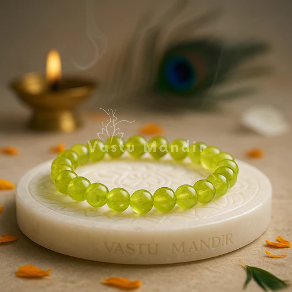 Natural peridot crystal bracelet shown in a second hand-held product view