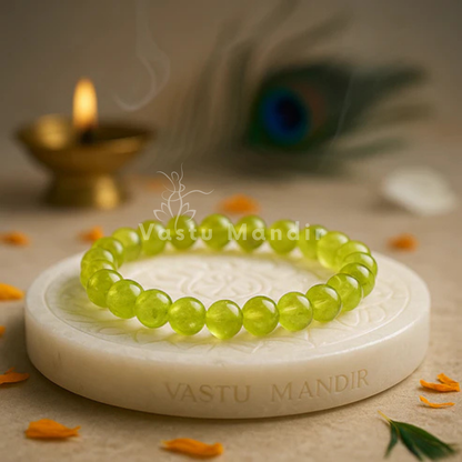 Natural peridot crystal bracelet shown in a second hand-held product view