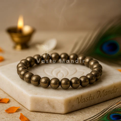Natural pyrite bracelet presented with a hand for visual scale