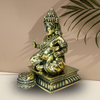 Brass Lord Dhan Kuber Ji idol right-side view showing the pot and square base