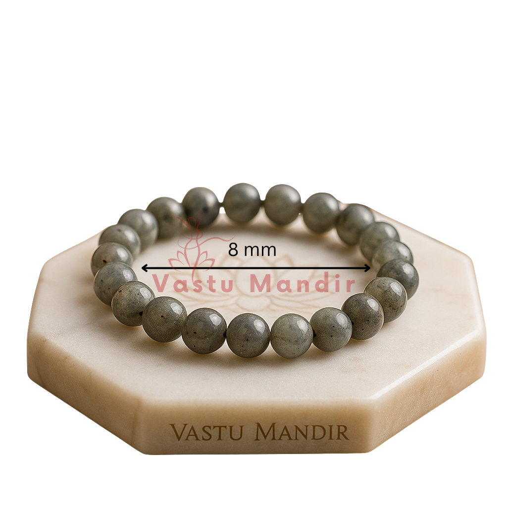Natural labradorite crystal bracelet presented with a hand for visual scale
