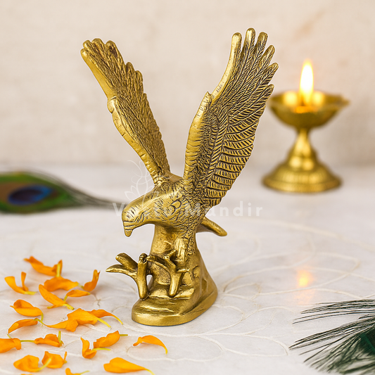 Brass eagle idol Vastu remedy displayed in a softly lit product setting