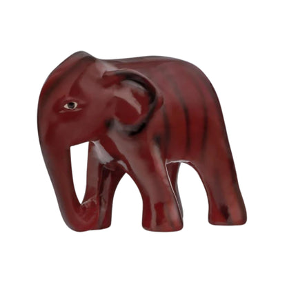 A red resin elephant figurine intended as a decorative item for home or office decor.
