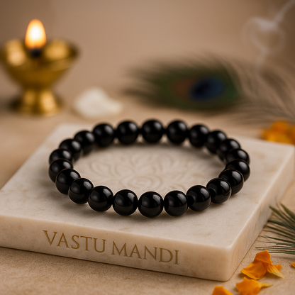 Natural garnet crystal bracelet shown in a second hand-held product view