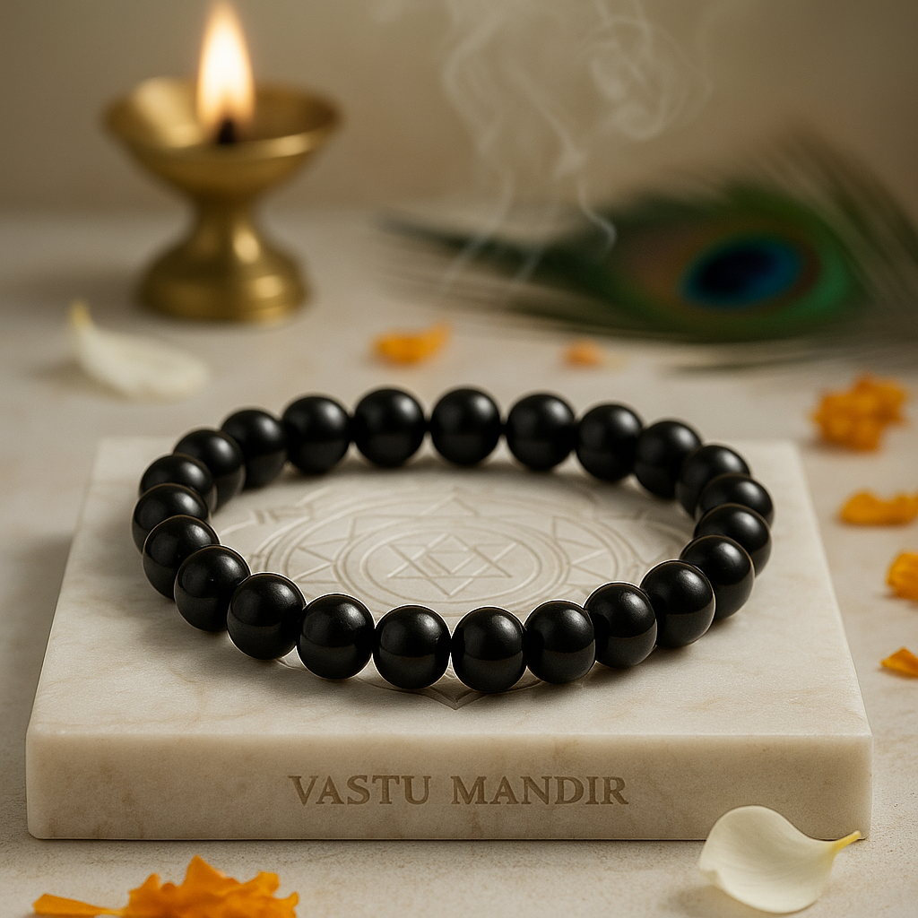 Natural black obsidian crystal bracelet shown with a hand in a lifestyle photograph