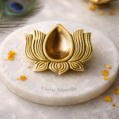 Brass lotus diya displayed in a softly lit product setting