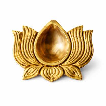 Brass lotus diya on a clean white background