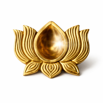 Brass lotus diya in a close product view on white