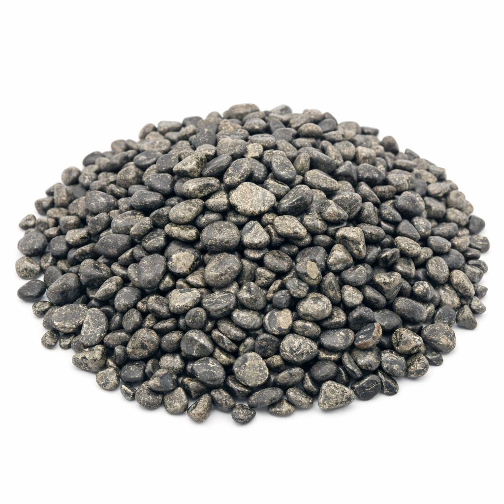 Pile of pyrite crystal chips on a clean white background