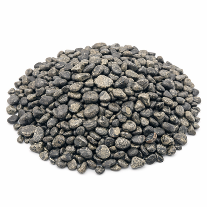 Pile of pyrite crystal chips on a clean white background