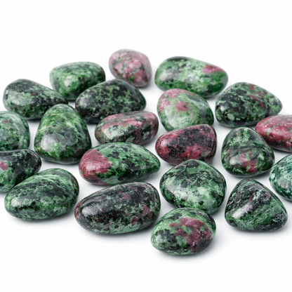Ruby zoisite tumbled stones in a close-up view against a clean white background