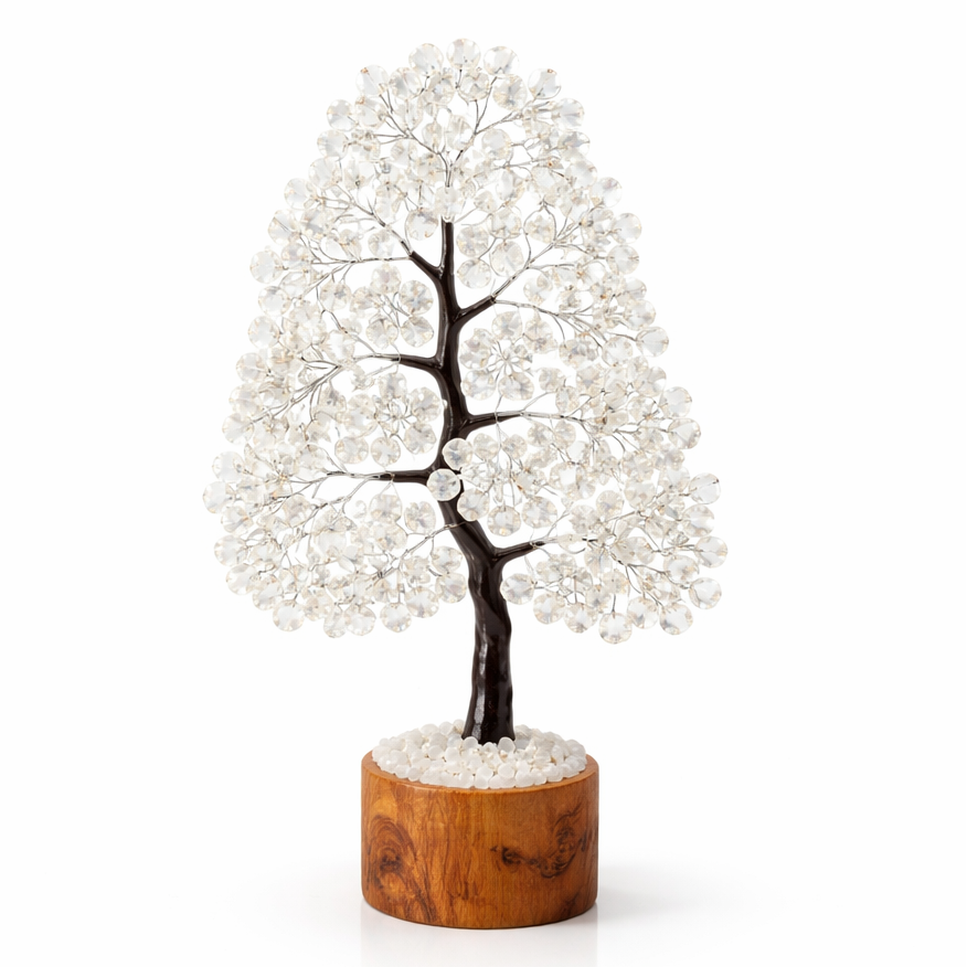 Decorative tree with white beads on a wooden base against a white background