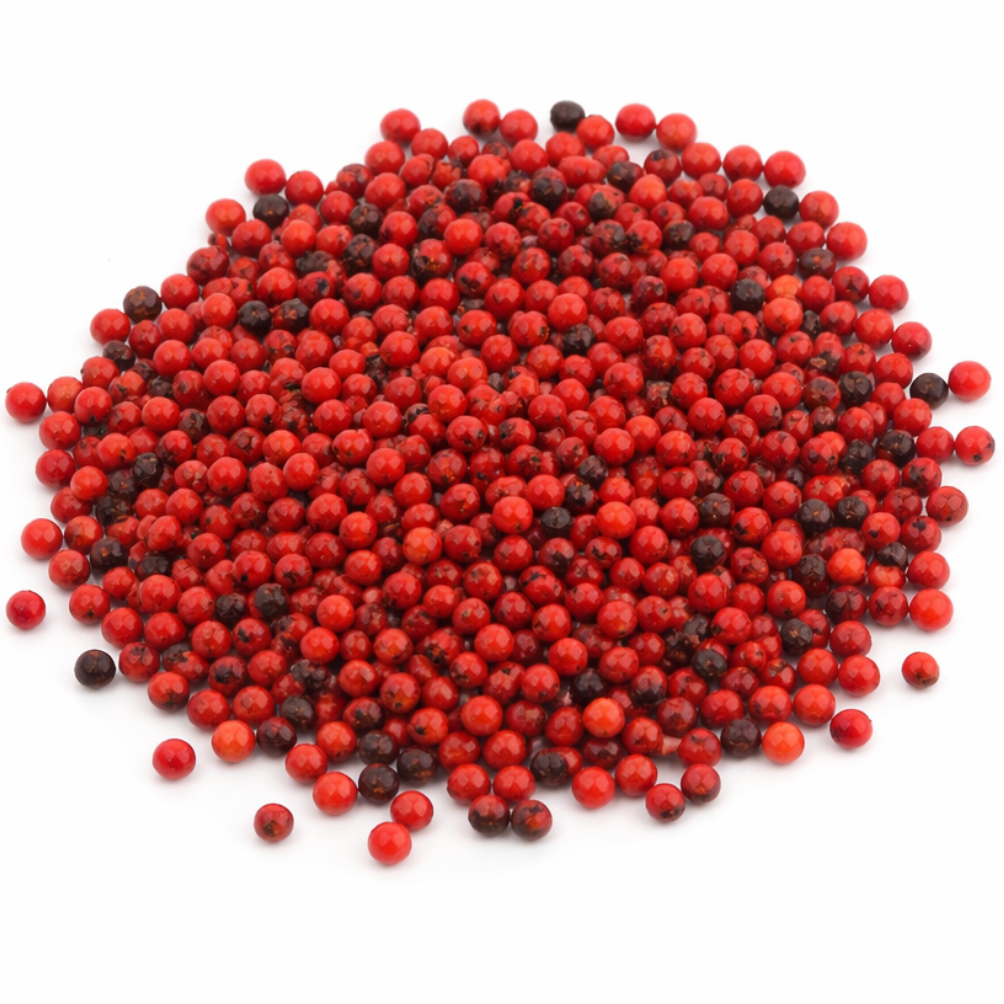 Pile of small red and black gumchi seeds isolated on a clean white background
