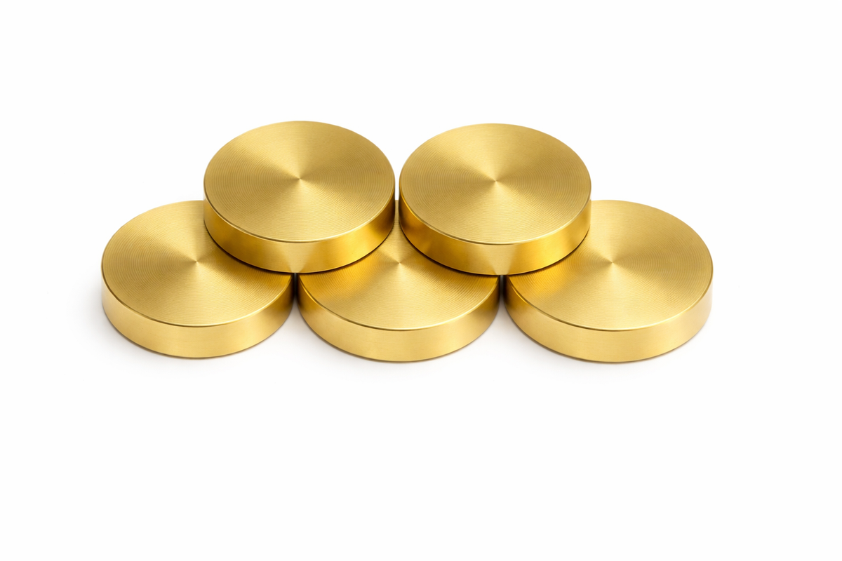Copper & brass Vastu coins on a clean white background