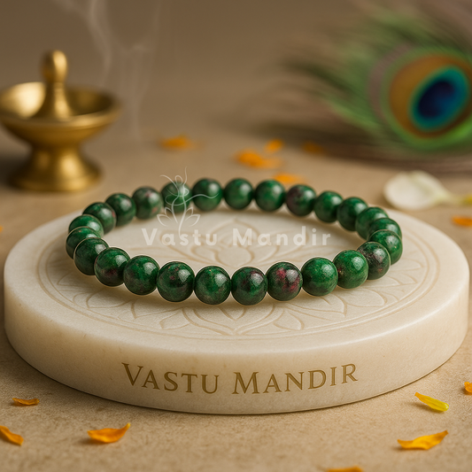 Natural Ruby Zoisite Bracelet — 8 mm Beads on a 'Vastu Mandir' stone with a peacock feather and incense in the background.