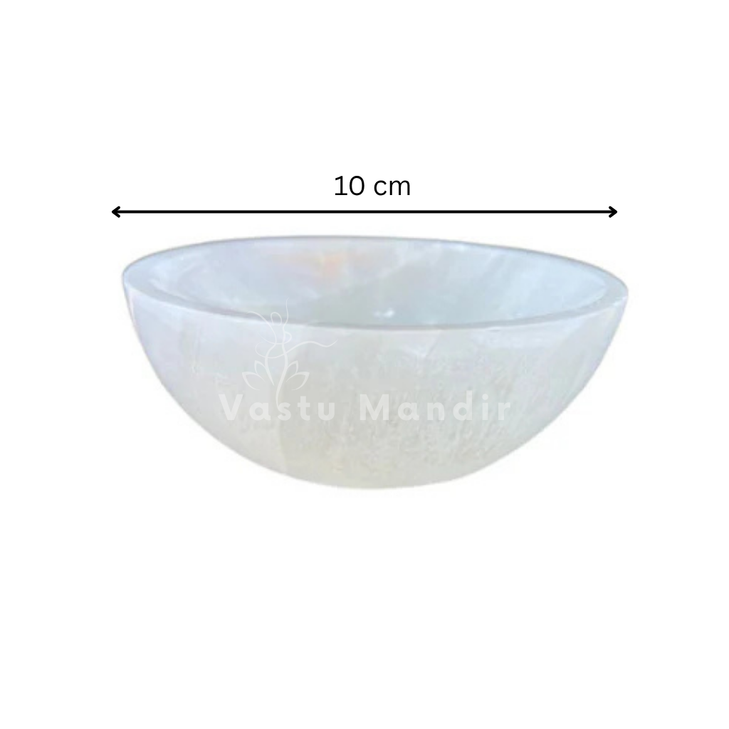 Round selenite charging bowl in a close product view on white
