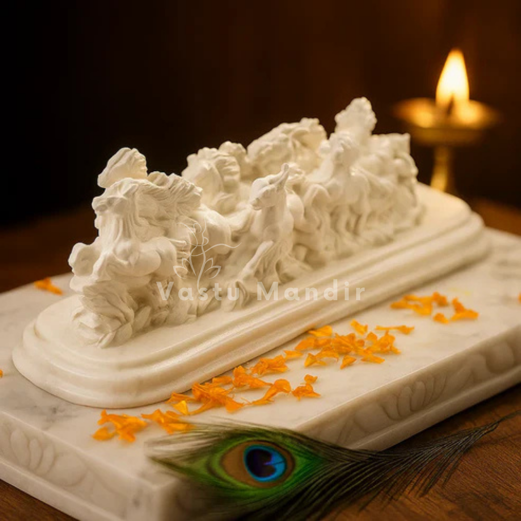 Twelve white running horses resin sculpture displayed with marigold petals and a lit brass diya