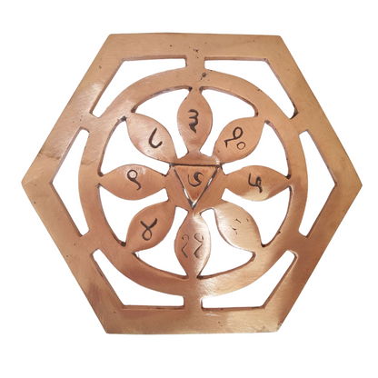Copper bhoum yantra in a close-up view against a clean white background