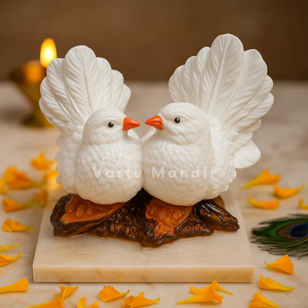 Pair of white love birds resin figurines in an elegant decorative setting