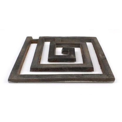 Low angled view of the iron square spiral helix on a white background