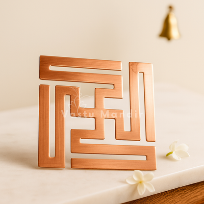 Copper nandavrat Swastik yantra arranged in a styled spiritual setting