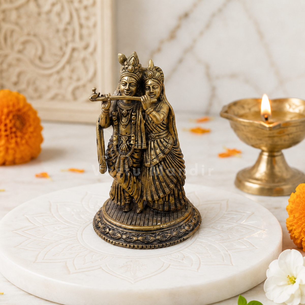 Brass Radha Krishna idol alternate front view on a marble platform