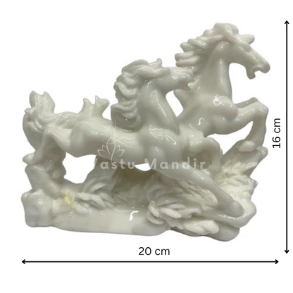 White running horse pair displayed in a styled interior setting